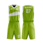 Custom basketball uniform in green with a modern skyline design and white accents, front and back views.