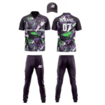 Custom cricket uniform kit with a green and purple abstract pattern, including a cap, jersey, and trousers by Adrees Enterprises.
