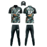 Custom cricket uniform kit with an orange and green abstract pattern, including a cap, jersey, and trousers by Adrees Enterprises.
