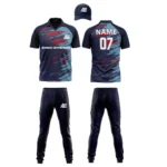 Custom cricket uniform kit with a navy and red abstract design, including a cap, jersey, and trousers by Adrees Enterprises.