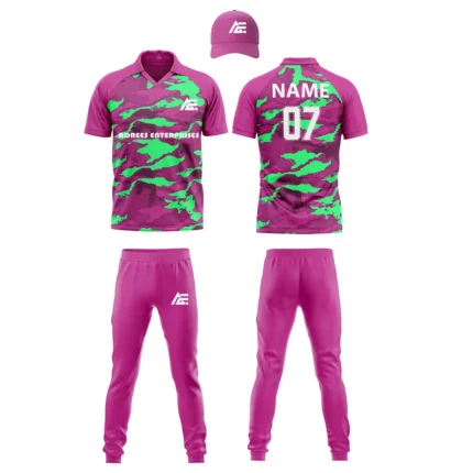 Custom cricket uniform kit with a pink and green abstract design, including a cap, jersey, and trousers by Adrees Enterprises.