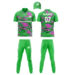 Custom cricket uniform kit with a green and pink abstract design, including a cap, jersey, and trousers by Adrees Enterprises.