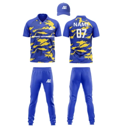 Custom cricket uniform kit with a blue and yellow abstract design, including a cap, jersey, and trousers by Adrees Enterprises.