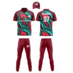 Custom cricket uniform kit in maroon and teal featuring a sharp angular pattern and branding by Adrees Enterprises.