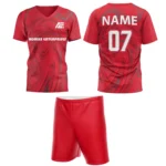 Custom field hockey uniform in vibrant red with swirl patterns and Adrees Enterprises branding.