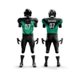 Black and green football uniform with modern graphic accents.