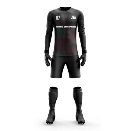 Black goalkeeper kit with subtle red and teal pattern details by Adrees Enterprises.