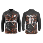 Black custom ice hockey jersey with orange star accents and bold patterns by Adrees Enterprises.
